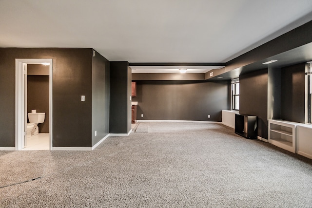 basement with light colored carpet