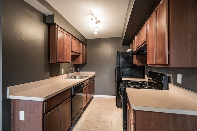 kitchen featuring dishwasher, rail lighting, sink, gas range, and light tile patterned floors