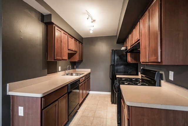 2900 E Jefferson Ave # A2, Detroit, MI 48207 - kitchen with black appliances, a sink, under cabinet range hood, light countertops, and baseboards