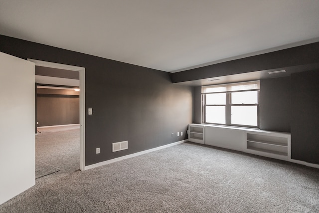 empty room featuring carpet flooring