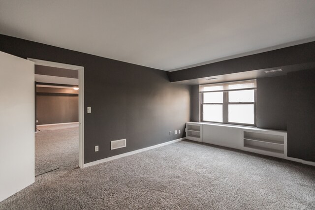 2900 E Jefferson Ave # A2, Detroit, MI 48207 - carpeted empty room with baseboards
