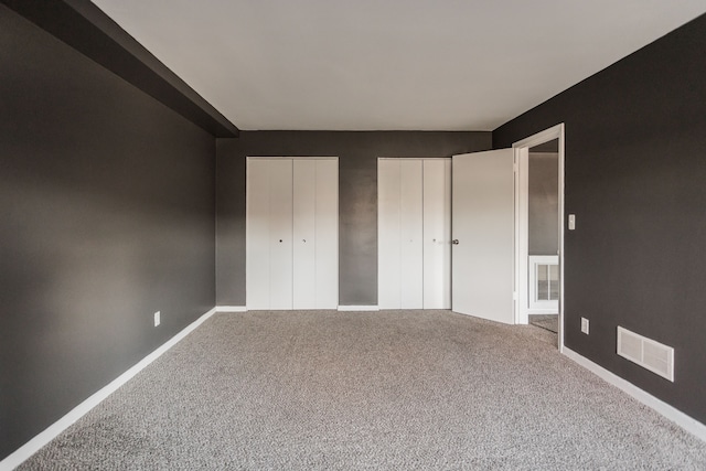 unfurnished bedroom with carpet floors