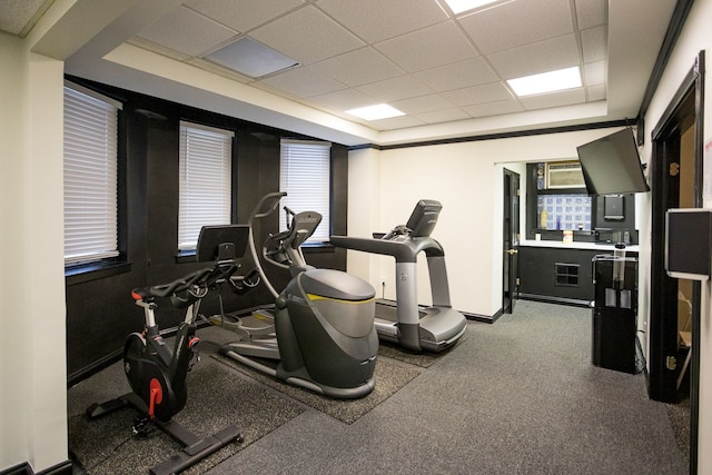 exercise room with a drop ceiling