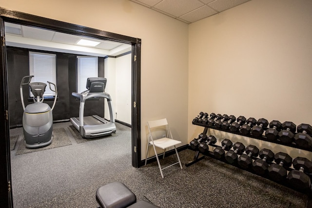 workout room featuring a paneled ceiling