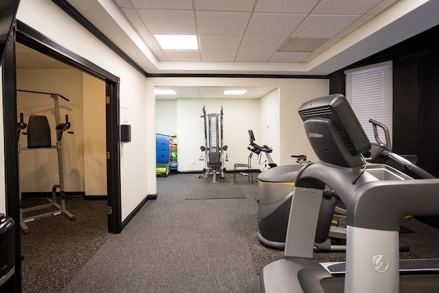 exercise room featuring a drop ceiling