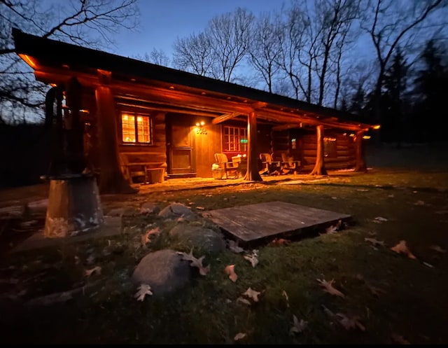 back of house featuring covered porch