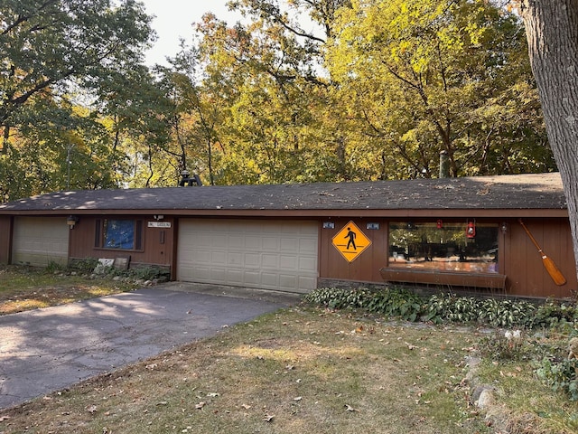 single story home with a garage