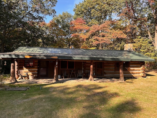 view of outdoor structure with a lawn