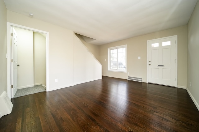 entrance foyer featuring dark hardwood / wood-style floors