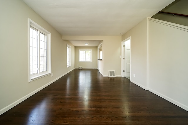 unfurnished room with dark hardwood / wood-style floors