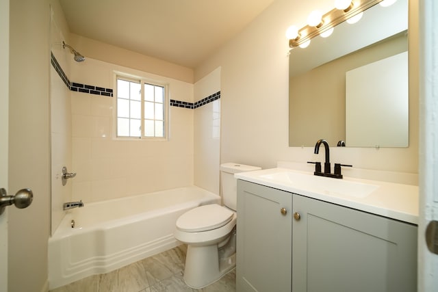 full bathroom featuring vanity, toilet, and tiled shower / bath