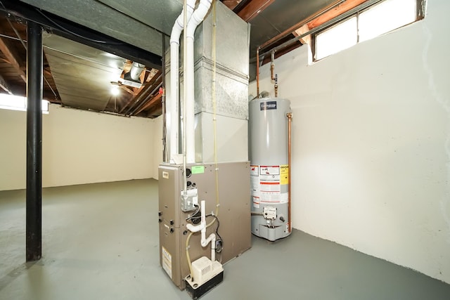 utility room with heating unit and water heater