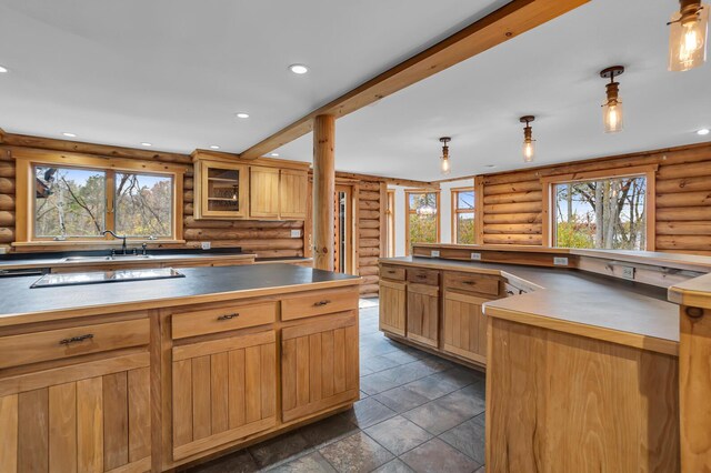 10560 Plaza Ct, Jerome, MI 49249 - kitchen featuring plenty of natural light, rustic walls, a sink, recessed lighting, and pendant lighting