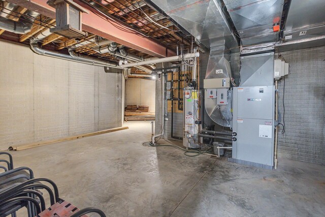 10560 Plaza Ct, Jerome, MI 49249 - unfinished below grade area featuring water heater and heating unit