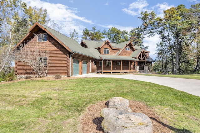10560 Plaza Ct, Jerome, MI 49249 - log cabin with a porch, a front yard, a garage, and driveway