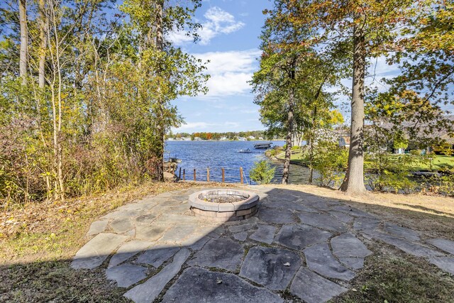 10560 Plaza Ct, Jerome, MI 49249 - view of patio / terrace with a fire pit and a water view