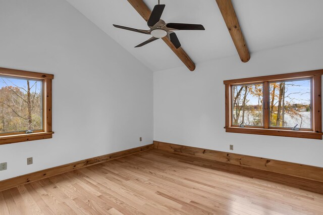 10560 Plaza Ct, Jerome, MI 49249 - empty room featuring beam ceiling, a ceiling fan, light wood-style flooring, baseboards, and high vaulted ceiling