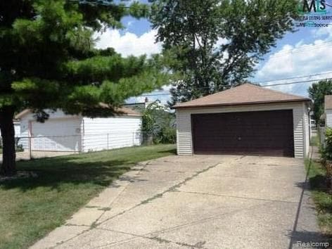 garage with a lawn