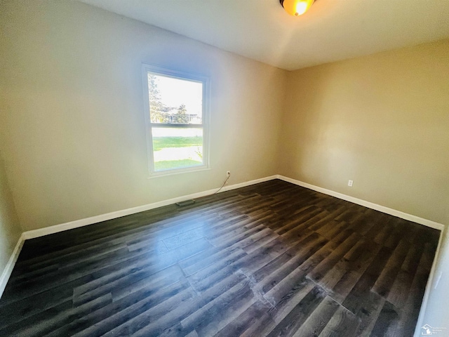 empty room featuring dark hardwood / wood-style floors