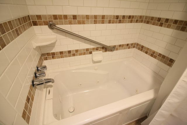 bathroom featuring a tub to relax in