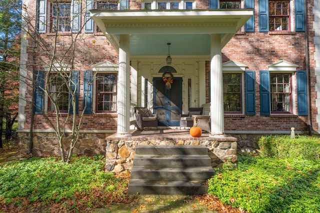 entrance to property with covered porch