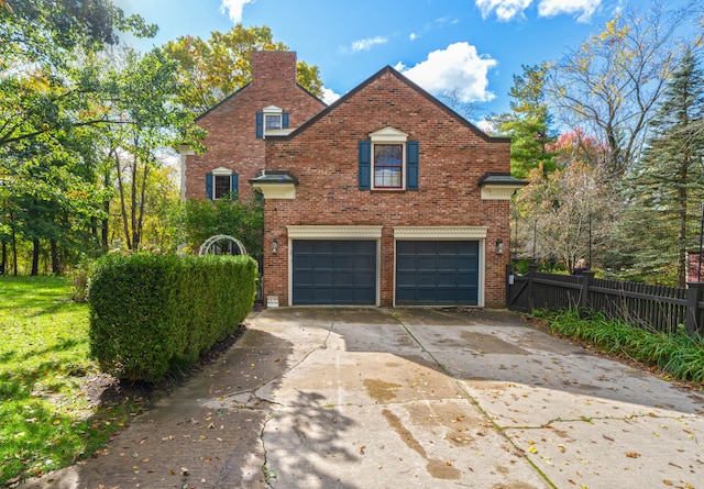 front facade with a garage