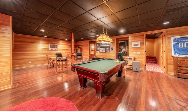 game room with hardwood / wood-style floors, a paneled ceiling, billiards, and wood walls