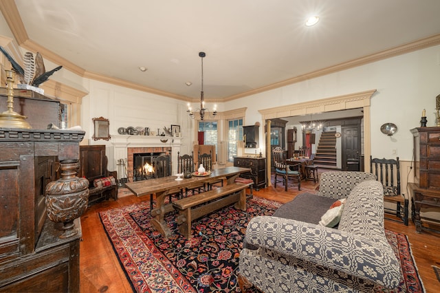 living room with hardwood / wood-style flooring and crown molding