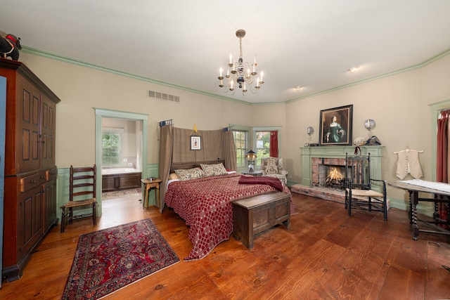 bedroom with multiple windows, dark hardwood / wood-style floors, and ornamental molding