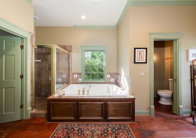 bathroom featuring toilet, crown molding, and plus walk in shower