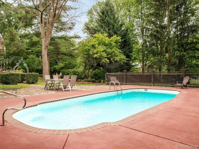 6230 Winkler Mill Rd, Rochester Hills, MI 48306 - view of pool featuring a patio area, view of scattered trees, and outdoor dining space