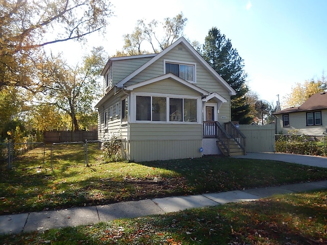 bungalow-style house featuring a front yard