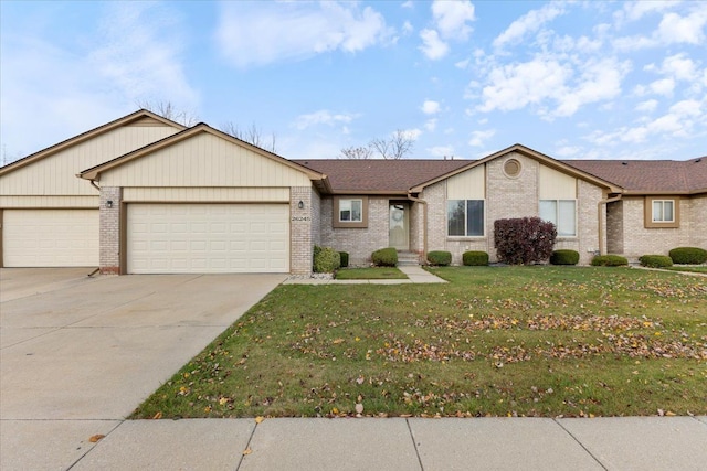 single story home featuring a front yard and a garage