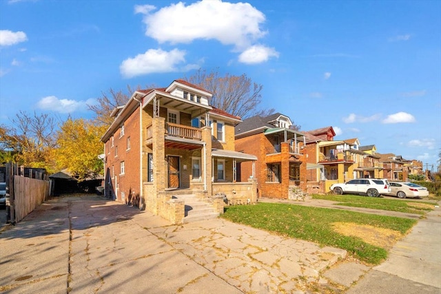 view of front of house with a balcony