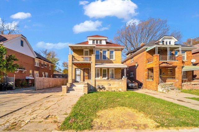 view of front of home featuring a balcony