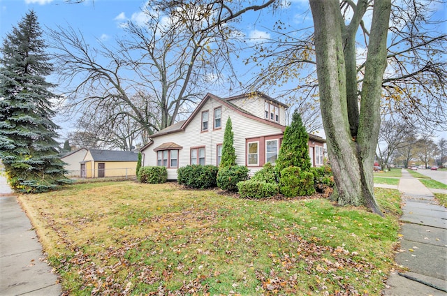 view of home's exterior with a yard