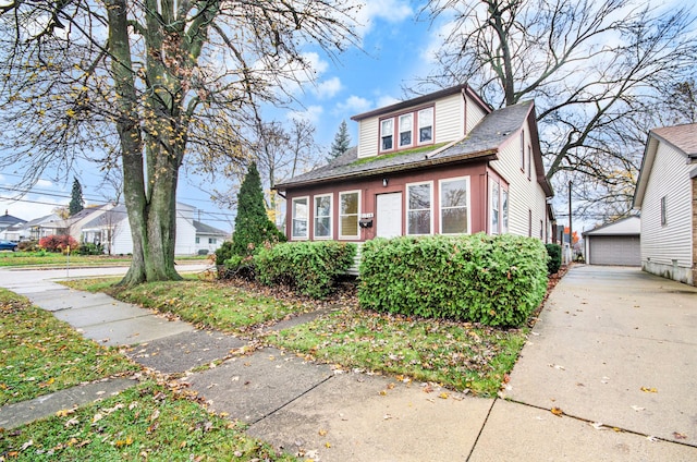 view of front of home featuring an outbuilding and a garage