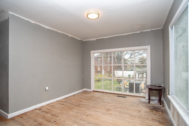 spare room featuring hardwood / wood-style flooring