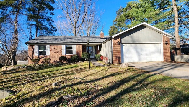 ranch-style home featuring a garage and a front lawn