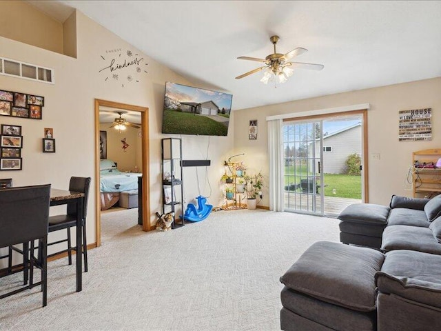 carpeted living room featuring ceiling fan