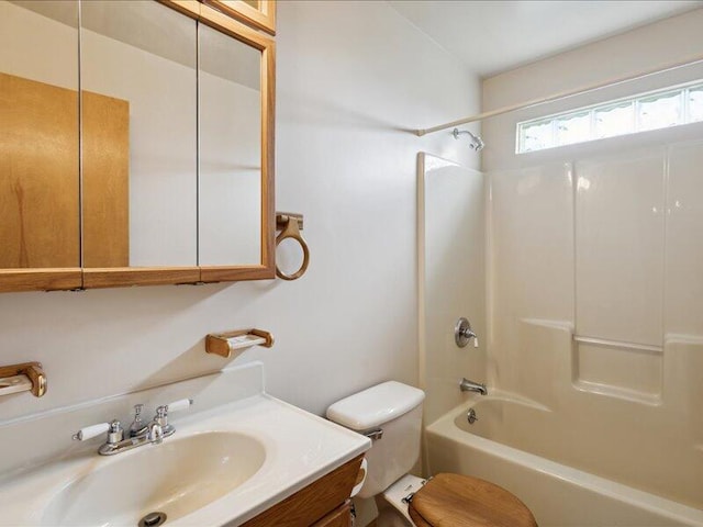 full bathroom with vanity, tub / shower combination, and toilet