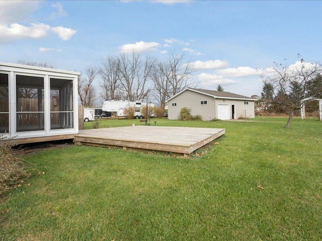 view of yard featuring a deck and a sunroom