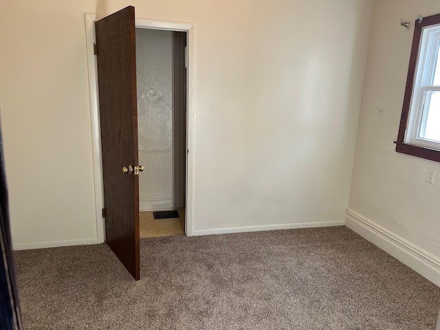 unfurnished room with carpet floors