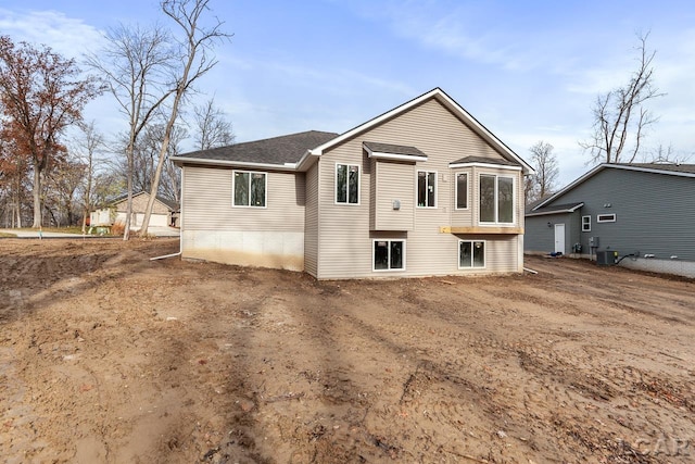 back of property with central AC unit