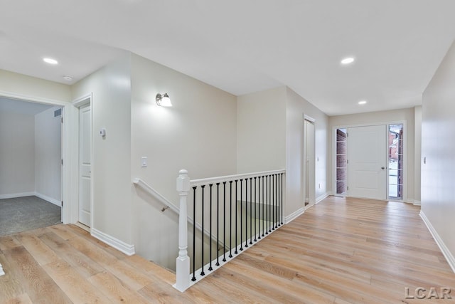 hall with light wood-type flooring