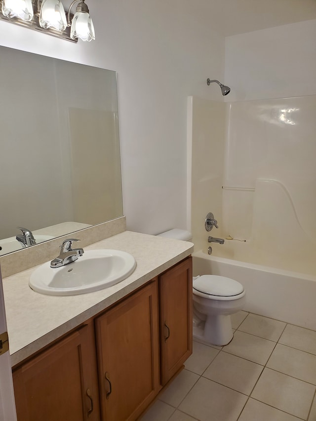 full bathroom featuring tile patterned flooring, vanity, toilet, and shower / washtub combination