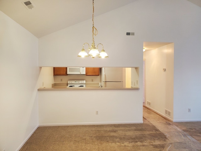 kitchen featuring light colored carpet, white appliances, hanging light fixtures, and a chandelier