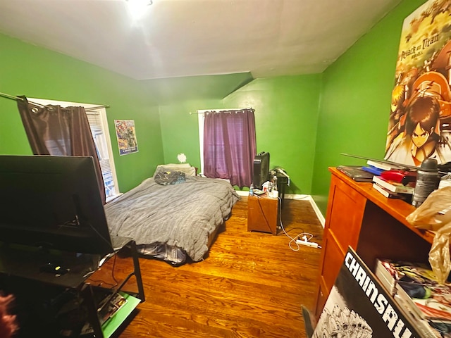 bedroom with wood-type flooring