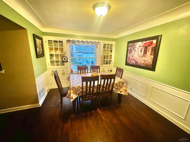 dining space with dark hardwood / wood-style floors