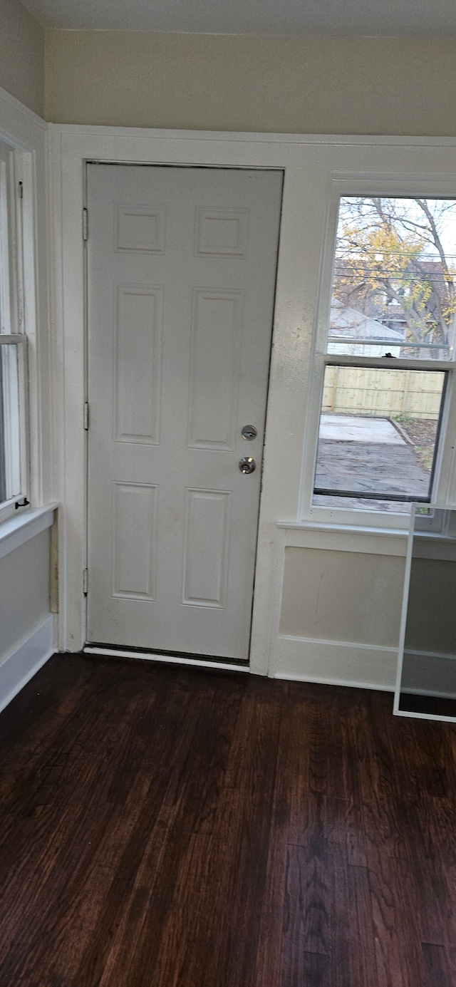 entryway with dark hardwood / wood-style floors